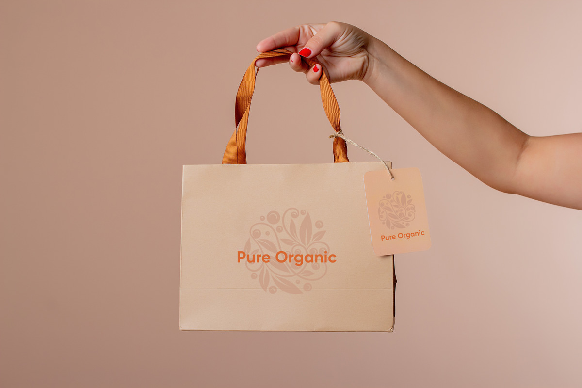 Bolsa papel con asa de tela de color naranja